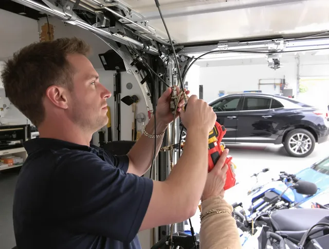 Barberton Garage Door Repair safety certified technician performing cable replacement in Barberton