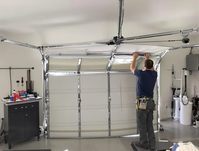 Barberton Garage Door Repair specialist performing precise section replacement on Barberton garage door